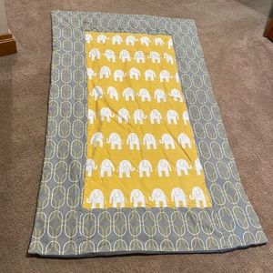 Crib blanket with elephants on it